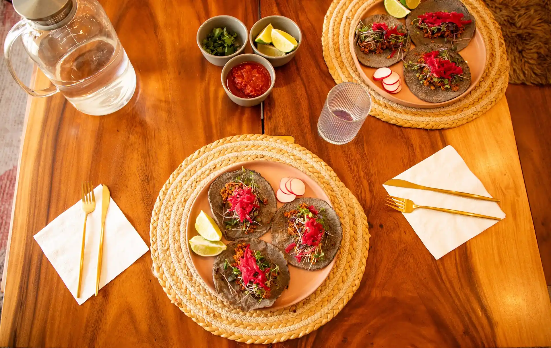 Freshly prepared plant-based tacos served with lime and salsa during a wellness retreat in Joshua Tree, California.